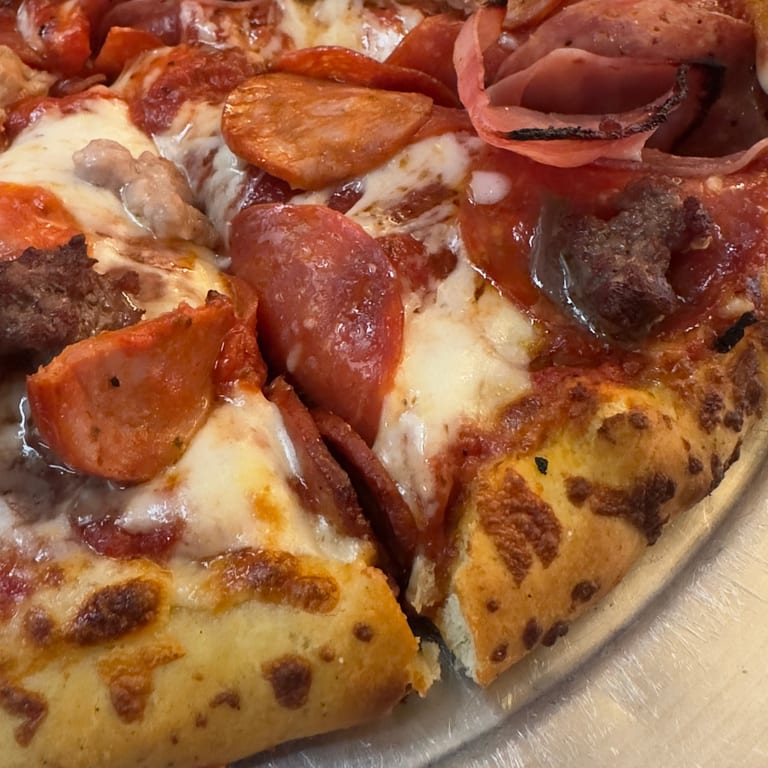 Indulge in Our Meat Pizza